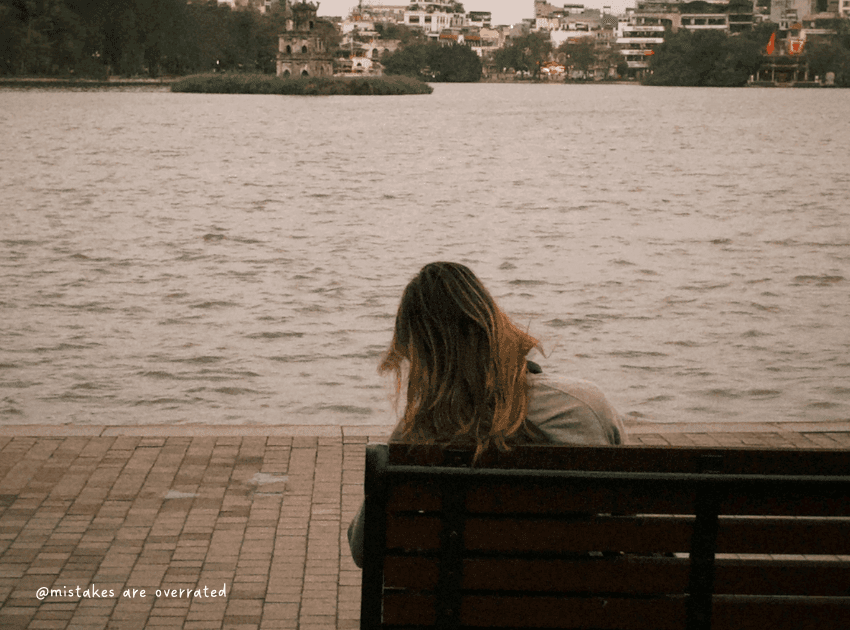 woman sitting on bench by herself