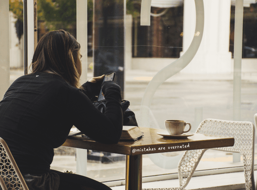 woman on her phone procrastinating
