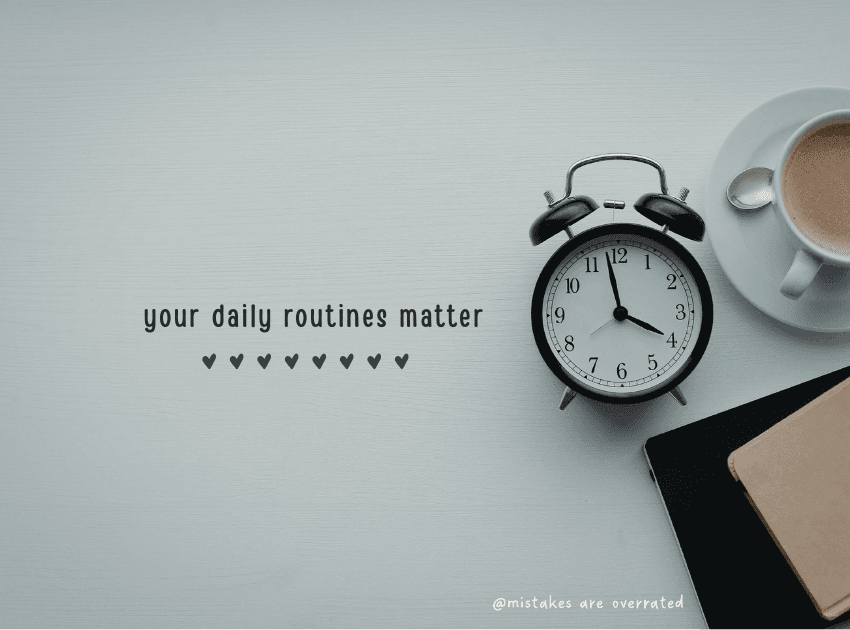 clock, coffee and notebook on desk with 'your daily routines matter'
