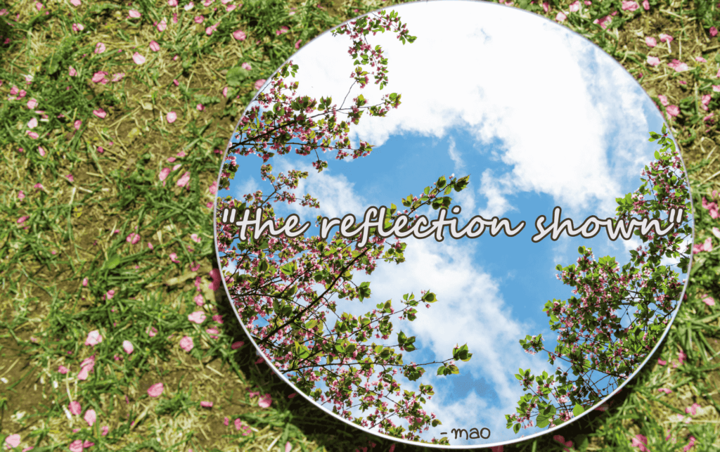 image of mirror on grass with tree and sky reflection with poem title "the reflection shown" bold